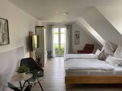 Ein Bett oder Betten in einem Zimmer der Unterkunft Ferienwohnung Weingut Sturm