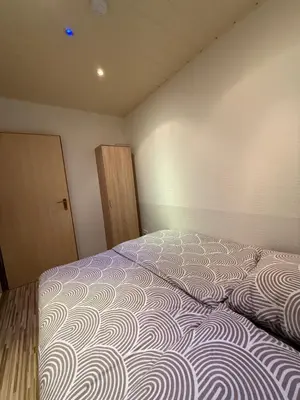 Ein Bett oder Betten in einem Zimmer der Unterkunft Neu renovierte Ferienwohnung mit Terrasse & schnellem WLAN im Odenwald