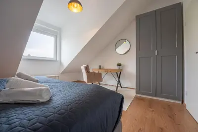 Ein Bett oder Betten in einem Zimmer der Unterkunft SCHLOSSBERG RESIDENCES - Design City-Apartment Nähe SAP und Hockenheimring