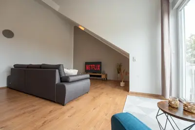 Ein Sitzbereich in der Unterkunft SCHLOSSBERG RESIDENCES - Design City-Apartment Nähe SAP und Hockenheimring