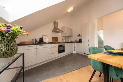 Küche/Küchenzeile in der Unterkunft SCHLOSSBERG RESIDENCES - Design City-Apartment Nähe SAP und Hockenheimring
