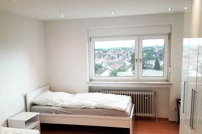 Ein Bett oder Betten in einem Zimmer der Unterkunft City Apartment near Heidelberg