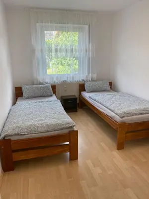 Ein Bett oder Betten in einem Zimmer der Unterkunft Ferienwohnung Grimm 2