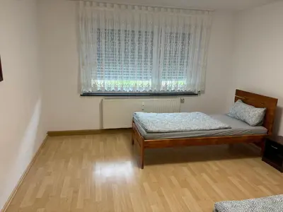 Ein Bett oder Betten in einem Zimmer der Unterkunft Ferienwohnung Grimm 2
