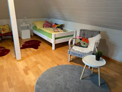 Ein Bett oder Betten in einem Zimmer der Unterkunft Ferienwohnung Orts-Idyll