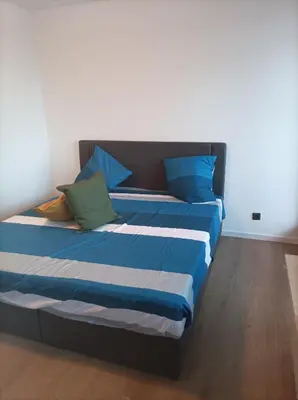 Ein Bett oder Betten in einem Zimmer der Unterkunft RK living room