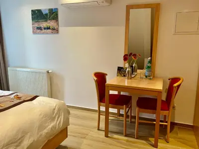 Ein Bett oder Betten in einem Zimmer der Unterkunft Gästehaus LINH