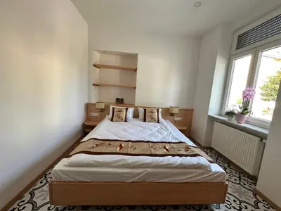 Ein Bett oder Betten in einem Zimmer der Unterkunft Gästehaus LINH