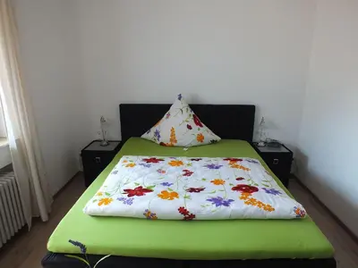 Ein Bett oder Betten in einem Zimmer der Unterkunft Gästehaus Müller