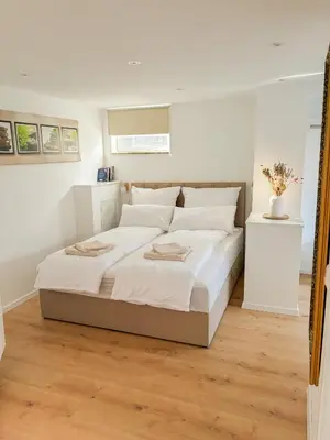 Ein Bett oder Betten in einem Zimmer der Unterkunft Ferienwohnung Fröhlich