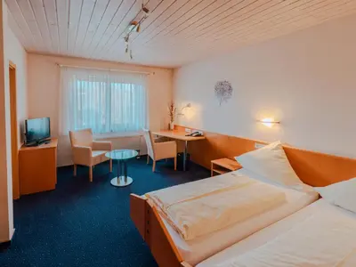 Ein Bett oder Betten in einem Zimmer der Unterkunft Gästehaus Kraft