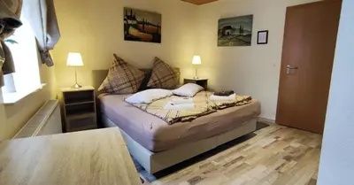 Ein Bett oder Betten in einem Zimmer der Unterkunft Pension Zur Schlummerstube