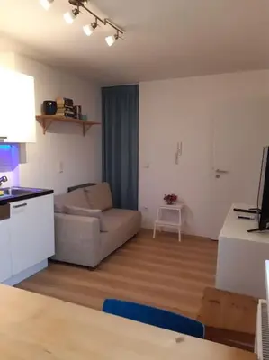 Ein Sitzbereich in der Unterkunft Apartment mit Innenhof, Rasen und Parkplatz