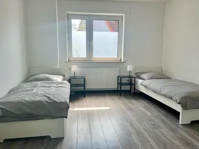 Ein Bett oder Betten in einem Zimmer der Unterkunft Monteur- und Arbeiterunterkunft Adlerstraße