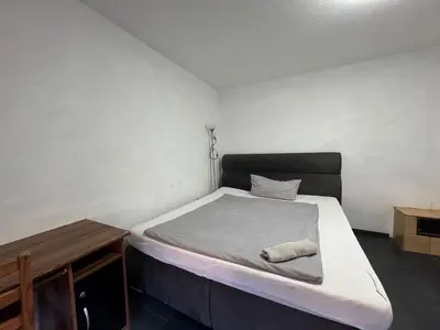 Ein Bett oder Betten in einem Zimmer der Unterkunft Zimmer mit gemeinschaftsbad