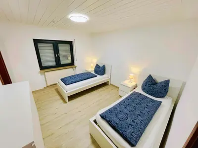 Ein Bett oder Betten in einem Zimmer der Unterkunft Panoramablick Ferien- und Monteurwohnung OG