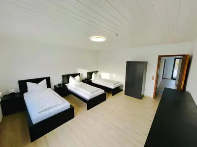 Ein Bett oder Betten in einem Zimmer der Unterkunft Panoramablick Ferien- und Monteurwohnung OG