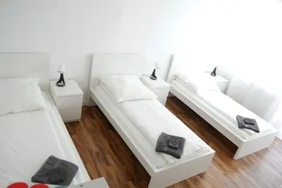 Ein Bett oder Betten in einem Zimmer der Unterkunft Moderne 3-Zimmer-Wohnung für bis zu 7 Personen