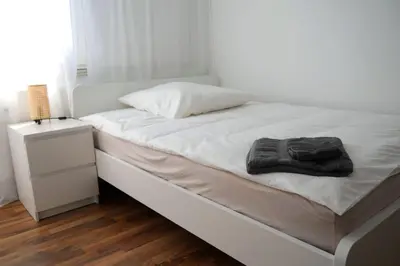 Ein Bett oder Betten in einem Zimmer der Unterkunft Moderne 3-Zimmer-Wohnung für bis zu 7 Personen
