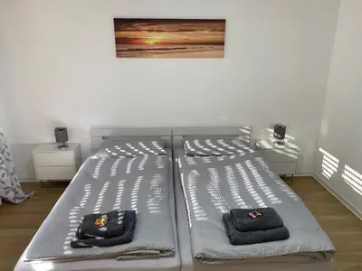 Ein Bett oder Betten in einem Zimmer der Unterkunft Sunny Suite mit Balkon - Küche - Bad