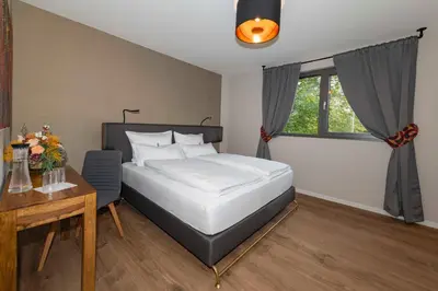 Ein Bett oder Betten in einem Zimmer der Unterkunft Ada's Buka Chalet auf dem Felsberg