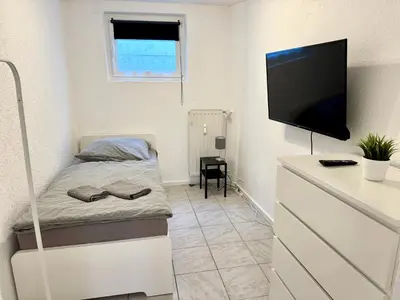 Ein Bett oder Betten in einem Zimmer der Unterkunft Hyra Living- Apartment in Ilsfeld nahe A81