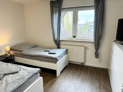 Ein Bett oder Betten in einem Zimmer der Unterkunft Hyra Living- Apartment in Ilsfeld nahe A81