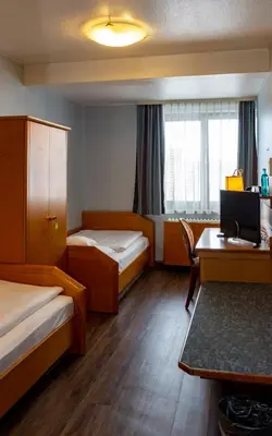 Ein Bett oder Betten in einem Zimmer der Unterkunft Trip Inn Aschaffenburger Hof