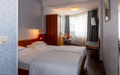 Ein Bett oder Betten in einem Zimmer der Unterkunft Trip Inn Aschaffenburger Hof