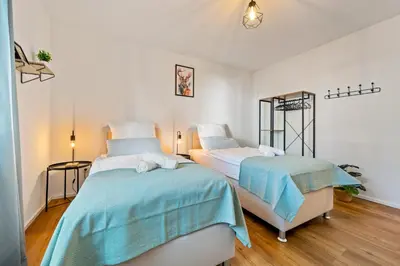 Ein Bett oder Betten in einem Zimmer der Unterkunft 3BR - Apartment am Theater