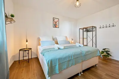 Ein Bett oder Betten in einem Zimmer der Unterkunft 3BR - Apartment am Theater