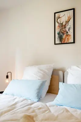 Ein Bett oder Betten in einem Zimmer der Unterkunft 3BR - Apartment am Theater