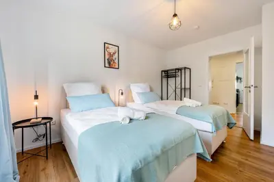Ein Bett oder Betten in einem Zimmer der Unterkunft 3BR - Apartment am Theater