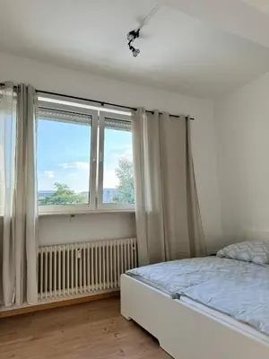 Ein Bett oder Betten in einem Zimmer der Unterkunft Family and Business Apartments Mannheim Three