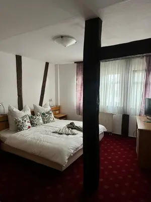 Ein Bett oder Betten in einem Zimmer der Unterkunft Frida Cantina Y Bar I Hotel