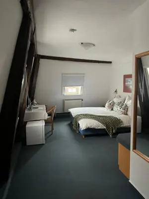 Ein Bett oder Betten in einem Zimmer der Unterkunft Frida Cantina Y Bar I Hotel