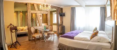 Ein Bett oder Betten in einem Zimmer der Unterkunft Friedrich von Schiller Hotel
