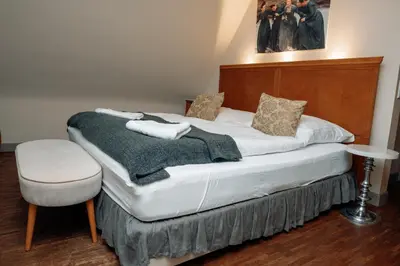 Ein Bett oder Betten in einem Zimmer der Unterkunft Friedrich von Schiller Hotel