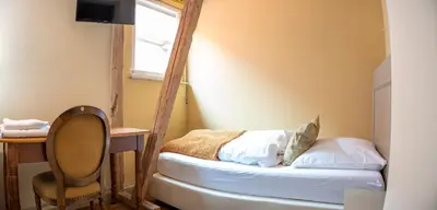 Ein Bett oder Betten in einem Zimmer der Unterkunft Friedrich von Schiller Hotel