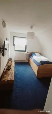 Ein Bett oder Betten in einem Zimmer der Unterkunft Haus Helga