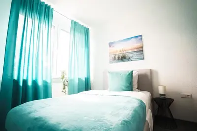 Ein Bett oder Betten in einem Zimmer der Unterkunft Hotel am Schafbaum