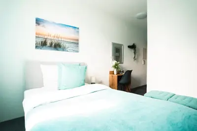 Ein Bett oder Betten in einem Zimmer der Unterkunft Hotel am Schafbaum