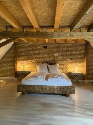 Ein Bett oder Betten in einem Zimmer der Unterkunft Ferienhaus Leon im Schloss und Hofgut Langenzell