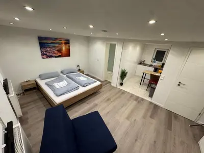 Ein Bett oder Betten in einem Zimmer der Unterkunft City Apart 2 nahe Badewelt, Museum & Bahnhof mit NETFLIX