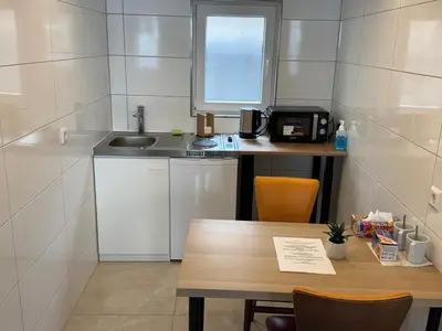 Küche/Küchenzeile in der Unterkunft City Apart 2 nahe Badewelt, Museum & Bahnhof mit NETFLIX