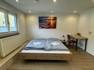 Ein Bett oder Betten in einem Zimmer der Unterkunft City Apart 3 nahe Badewelt, Museum & Bahnhof mit NETFLIX
