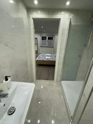 Ein Badezimmer in der Unterkunft City Apart 3 nahe Badewelt, Museum & Bahnhof mit NETFLIX