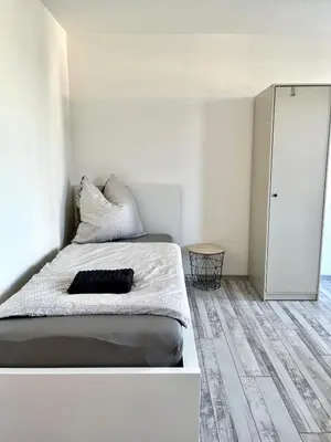 Ein Bett oder Betten in einem Zimmer der Unterkunft Audi - Neckarsulm - Bad - Küche - Balkon - 4 Personen