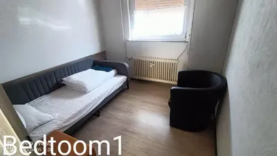 Ein Bett oder Betten in einem Zimmer der Unterkunft 1A Nauheim