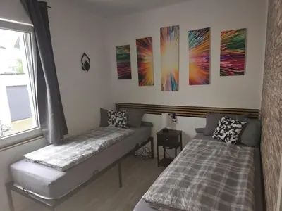 Ein Bett oder Betten in einem Zimmer der Unterkunft Zimmer mit eigenem Bad in Heidelberg